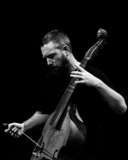 Liam Byrne playing the viol with his eyes closed