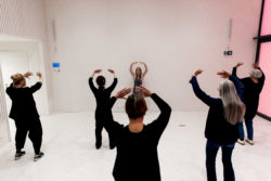 group of 6 persons exercising qigong