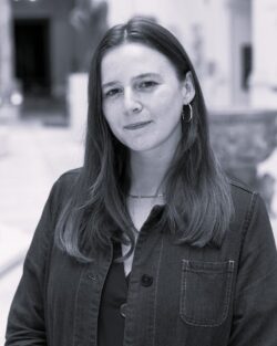 Portrait of a woman with long, brown hair; she is wearing a denim shirt.
