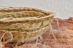 Twined basket of seagrass and wool with a base of hawthorn bark