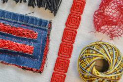 pieces of fabric stitched together, strips of fabric and a ball of sturdy yarn