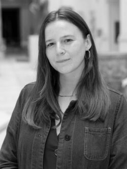 Portrait of a woman with long, brown hair; she is wearing a denim shirt.