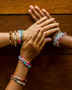 Hands with friendship bracelets