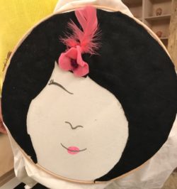 A human face made out of different textiles.