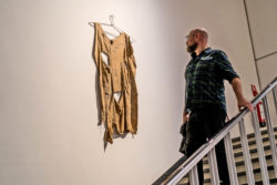 A visitor looks an artwork in the exhibition "Soft? Tactile Dialogues".