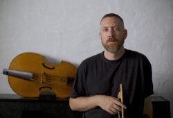 Liam Byrne sitting in front of his viol