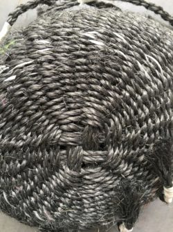 Twined basket of dark grey sisal rope
