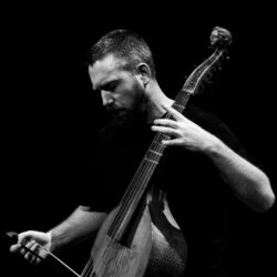 Liam Byrne playing the viol with his eyes closed