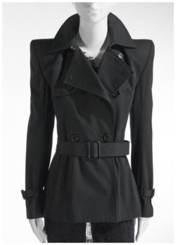 Mannequin in black fitted coat with accentuated shoulders