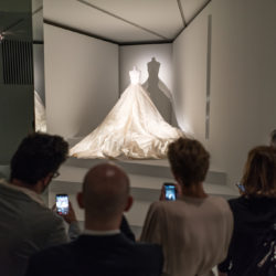 peoples in front of a wedding dress